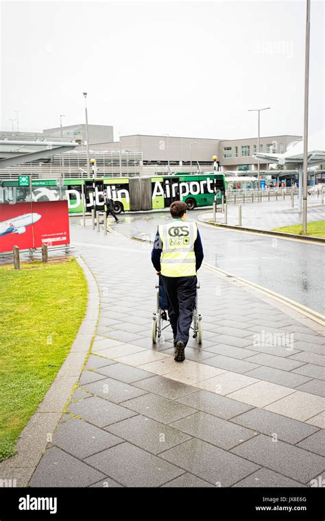 Dublin Airport People Passengers Travelling With Suitcases On Walkway