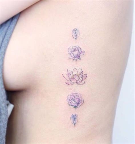 16 Delicate Flower Tattoos Just In Time For Your New Spring Ink Purple Tattoos Stylish Tattoo