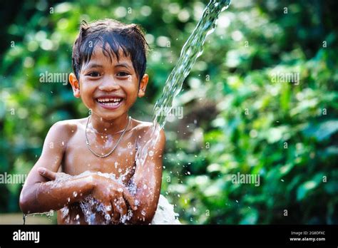Boy Bathing In The Water And The Green Of The Hi Res Stock Photography