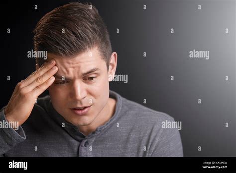 Portrait Of A Worried Young White Man Looking Down Stock Photo Alamy