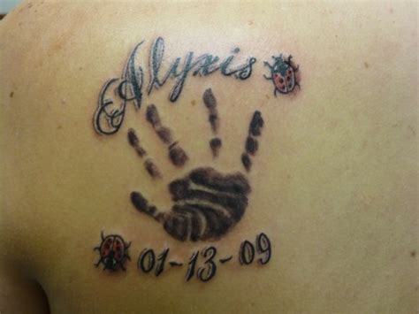 Baby footprint and handprint tattoo. 22 Cute and Crazy Baby Tattoos - ibytemedia