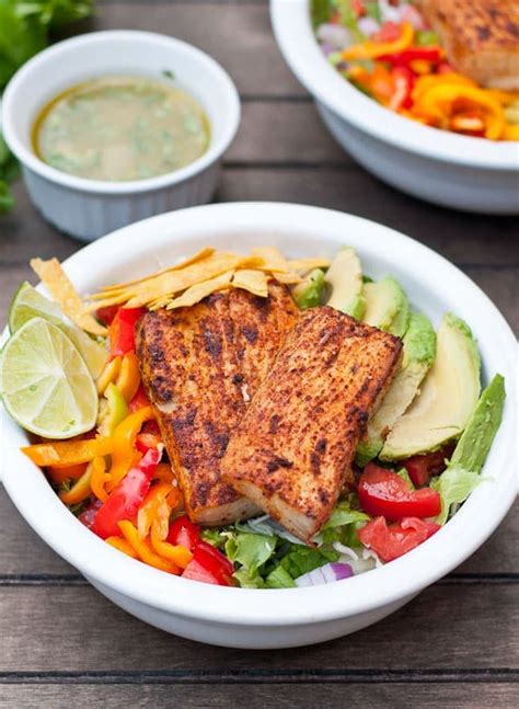 It really isn't difficult to convert a fish taco into a fish taco salad. Fish Taco Salads with Creamy Sriracha Lime Dressing