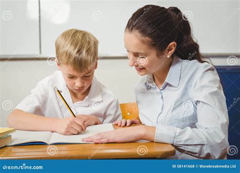 Teacher Helping A Student In Class Stock Photo Image Of Career Cute