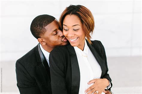 Kissing African American Husband And Wife Del Colaborador De Stocksy
