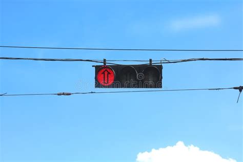 Street Traffic Signal With Red Signal And Arrow On Sky Background Stock