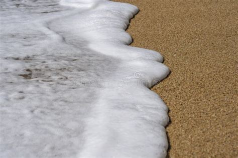 Soft Wave Of The Sea On The Sandy Beach With White Clean Foam Nature