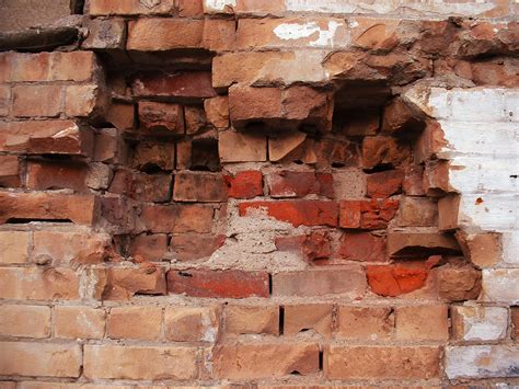 Free Holes In A Brick Wall Stock Photo