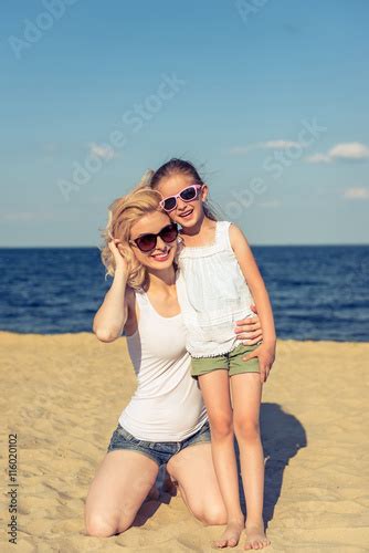 Mom And Daughter On The Beach Stock Photo Adobe Stock