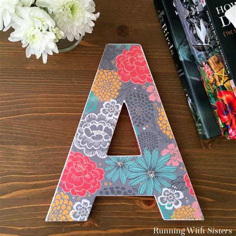 Make them 3d by adding perspective with diagonal lines, and then add shadows to make your letters really pop. Decorate A Wooden Letter Using Mod Podge - Running With ...