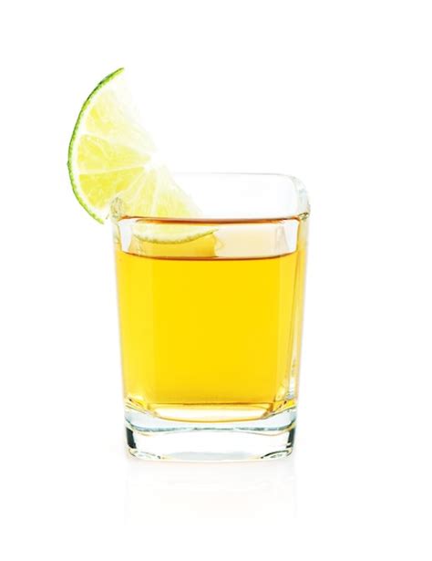 Premium Photo Shot Of Gold Tequila With Lime Slice