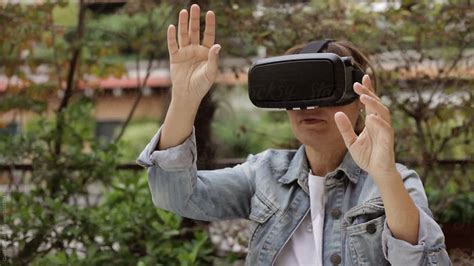 woman wearing 3d 360 vr glasses outdoor by stocksy contributor giada canu stocksy