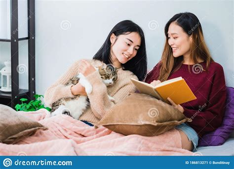Young Beautiful Asian Women Lesbian Couple Lover Reading