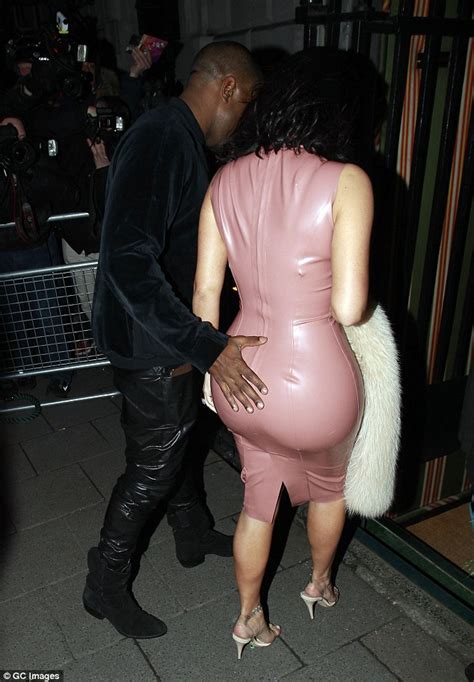 Kanye West Cant Resist Giving Wife Kim Kardashian A Cheeky Feel Of Her
