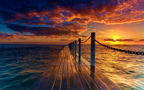 Sunset Sun Reflecrions Pier Clouds Sea Hd Wallpaper Peakpx