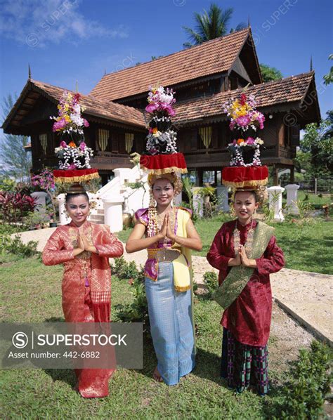 Portrait Of Three Teenage Girls Dressed In Traditional Malay Costumes