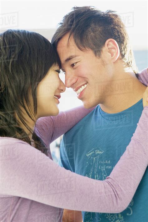 Asian Couple Hugging Stock Photo Dissolve