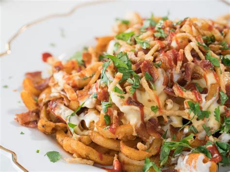 But instead of asking for yearwood's secret recipes, the first thing every tv host begs to know is the. Loaded Curly-Fry Nachos Recipe | Trisha Yearwood | Food Network