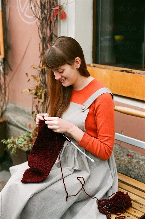 Young Woman Knitting Outdoors By Stocksy Contributor Amor Burakova