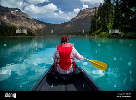 Woman Canoeing In Emerald Lake Yoho National Park British Columbia