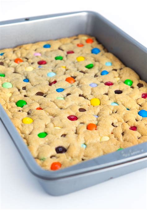 the best soft thick and chewy mandm cookie bars for any occasion bake in a standard 9×13 pan