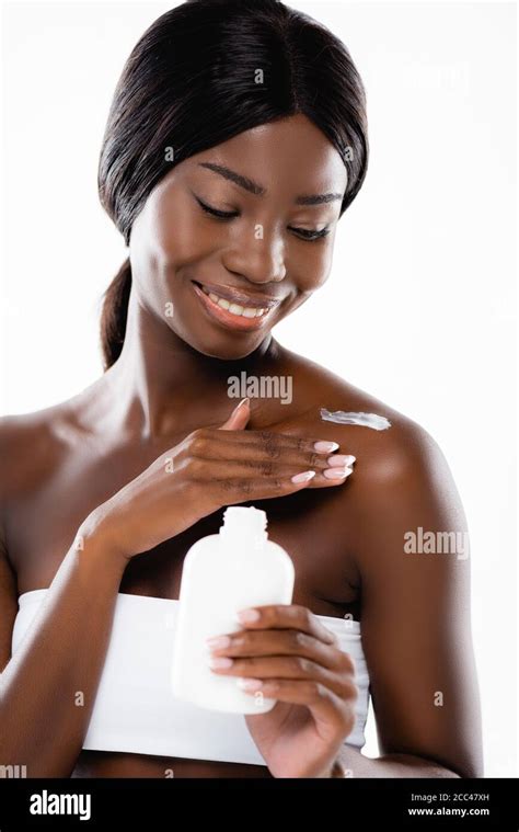 African American Woman Applying Body Lotion Isolated On White Stock Photo Alamy