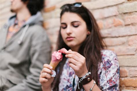 Handsome Teenager Girl Eating An Ice Cream Cone By Stocksy