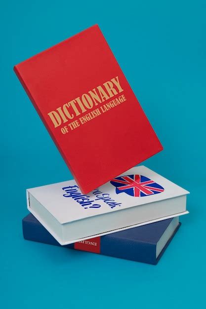 Free Photo English Dictionary And Books On Blue Background
