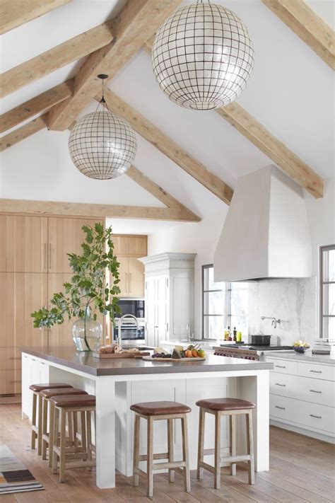The faux beams are installed on the ceiling via a ledger board attached. Vaulted ceiling + exposed wooden beams + ball chandelier ...