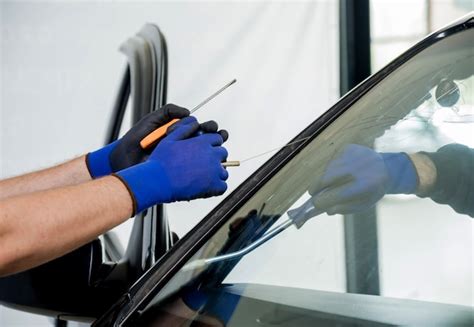 Premium Photo Automobile Special Workers Remove Old Windscreen Or