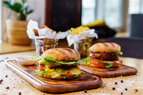 Dishes Delicious Burgers With Fresh Vegetables French Fries And