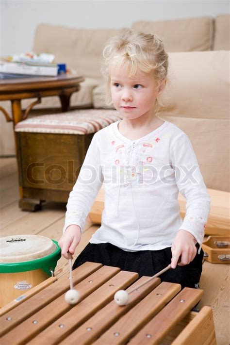 A Young Girl Playing The Xylophone Stock Image Colourbox