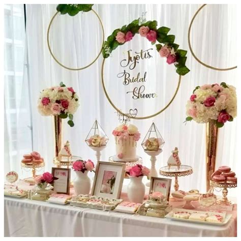 the dessert table at this rustic floral bridal shower is stunning love the backdrop
