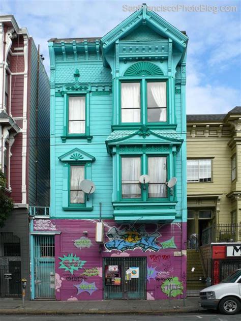 An Old Building Painted In Blue And Purple