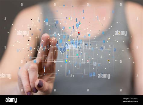 Hand Touching A Hologram Of A Grid With Binary Numbers Stock Photo Alamy