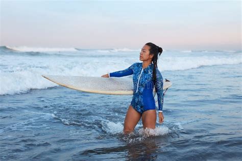 Beautiful Surfer Girl Surfing Woman With Surfboard Smiling Brunette Going To Surf In Ocean