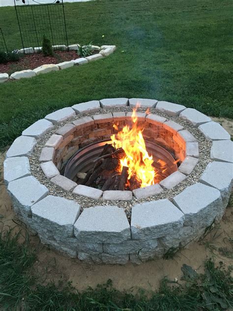 Retaining wall block fire pit ideas. Fire pit made from bricks, grout, gravel, and retaining ...