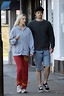 anya taylor-joy dresses down in a grey hoodie and red sweatpants while ...