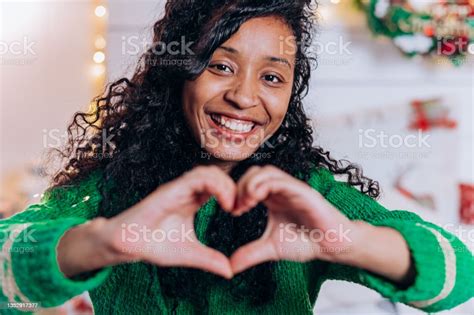 Portrait Of Cute African American Woman With Long Curly Hair Shows