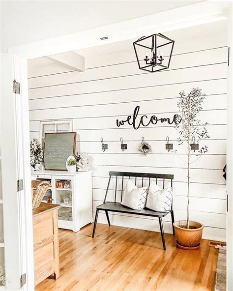 Beautiful White Shiplap Entry With Black Iron Accents And Honey Oak