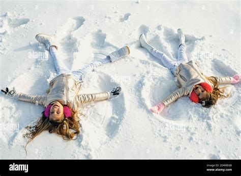 Children Making Snow Angels Hi Res Stock Photography And Images Alamy
