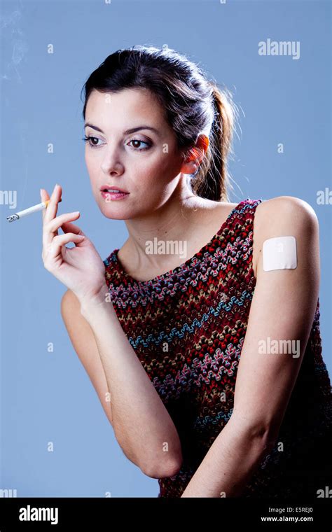 Woman With A Tobacco Control Patch And Smoking Stock Photo Alamy