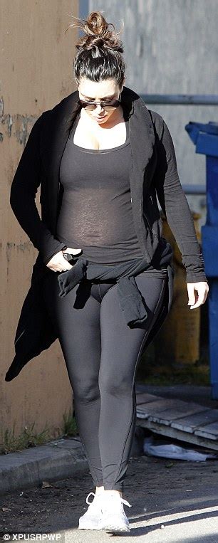 Kim Kardashian Gives A Glimpse Of Her Pregnant Belly In Sheer Top At