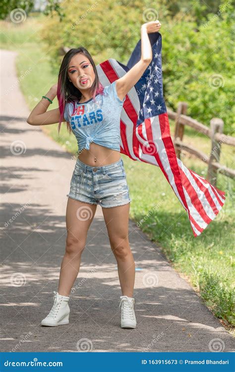 beautiful asian girl posing in the american independence day stock image image of trees