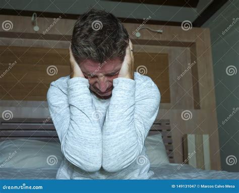 Dramatic Portrait Of Middle Aged Man Desperate And Depressed Crying At