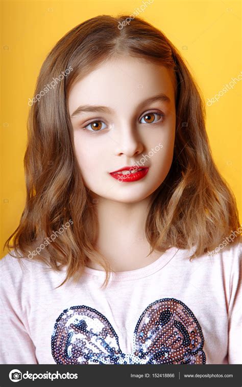 Cute little girl with red lips posing in studio — Stock Photo © YuliiaChupina #152418866