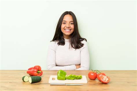 Premium Photo Young Brunette Woman With Lots Of Vegetables