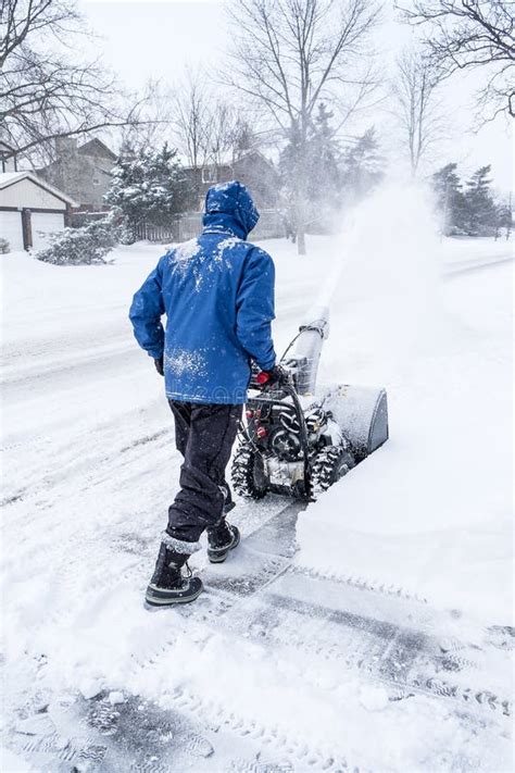 Man Removing Snow With A Snowblower 1 Stock Photo Image Of Removing