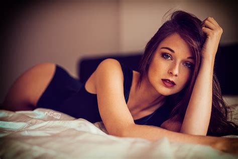 Wallpaper Women Brunette Blue Eyes Hands In Hair Lying On Front Bed Looking At Viewer