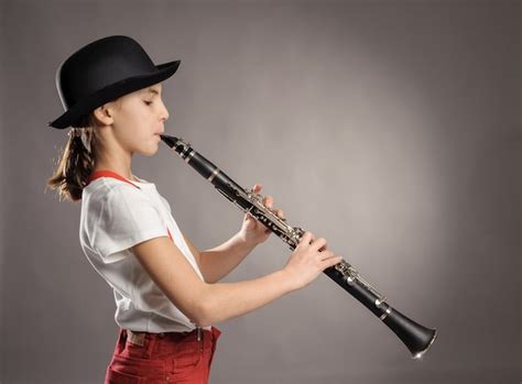 Woman Playing A Clarinet In Music School Free Photo