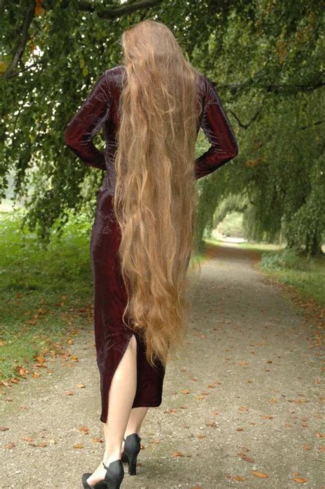Furthermore, from wash day to styling she only uses a few products to maintain her long locks. Knee length blonde tresses!!! | Long hair styles, Long ...